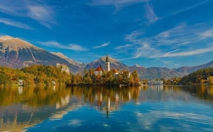 Lake Bled with the island church and the Julian Alps behind it