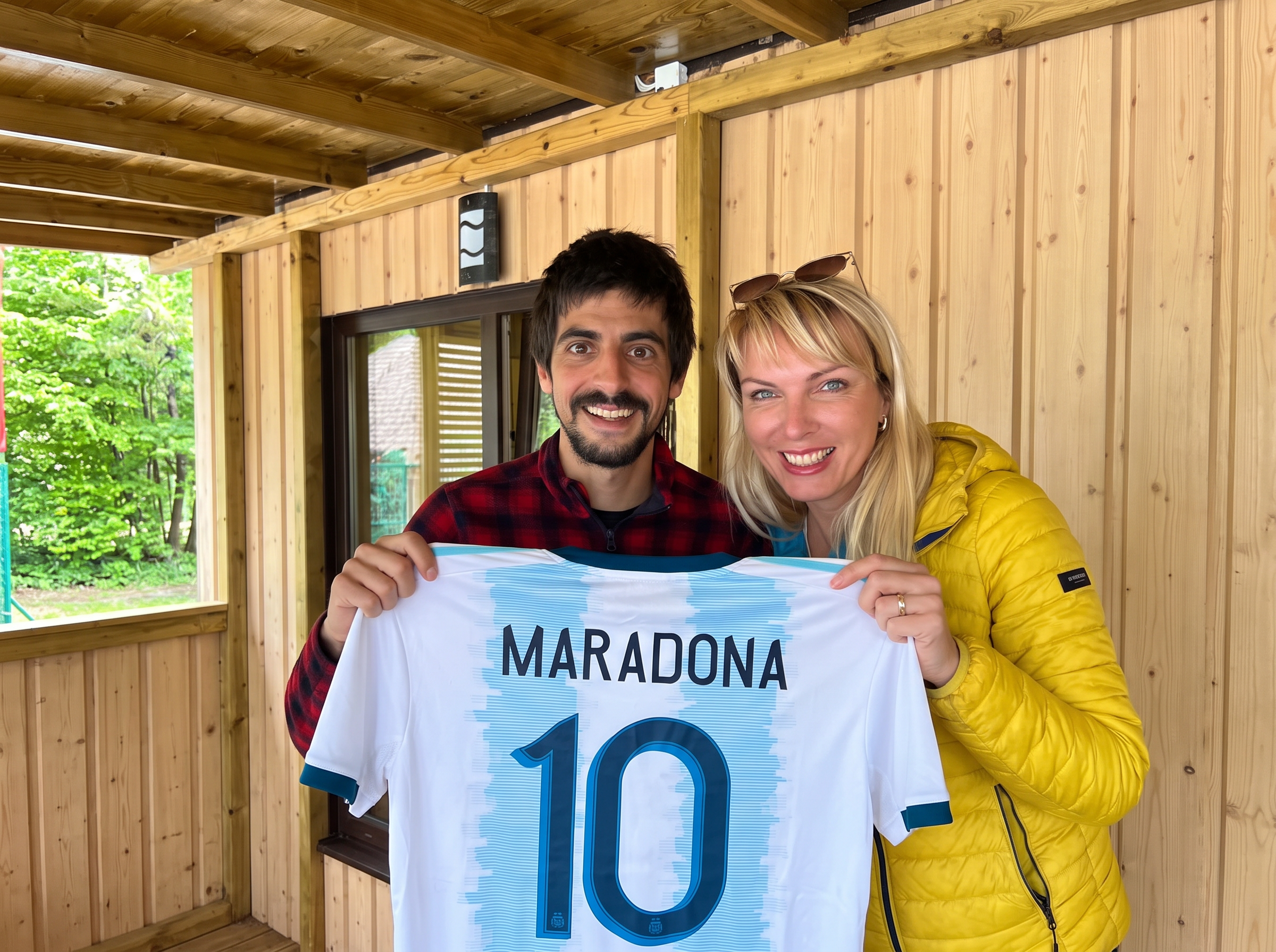 Uri and Klara holding a Maradona jersey